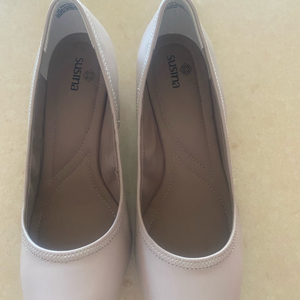 Woman’s nude wedge heels